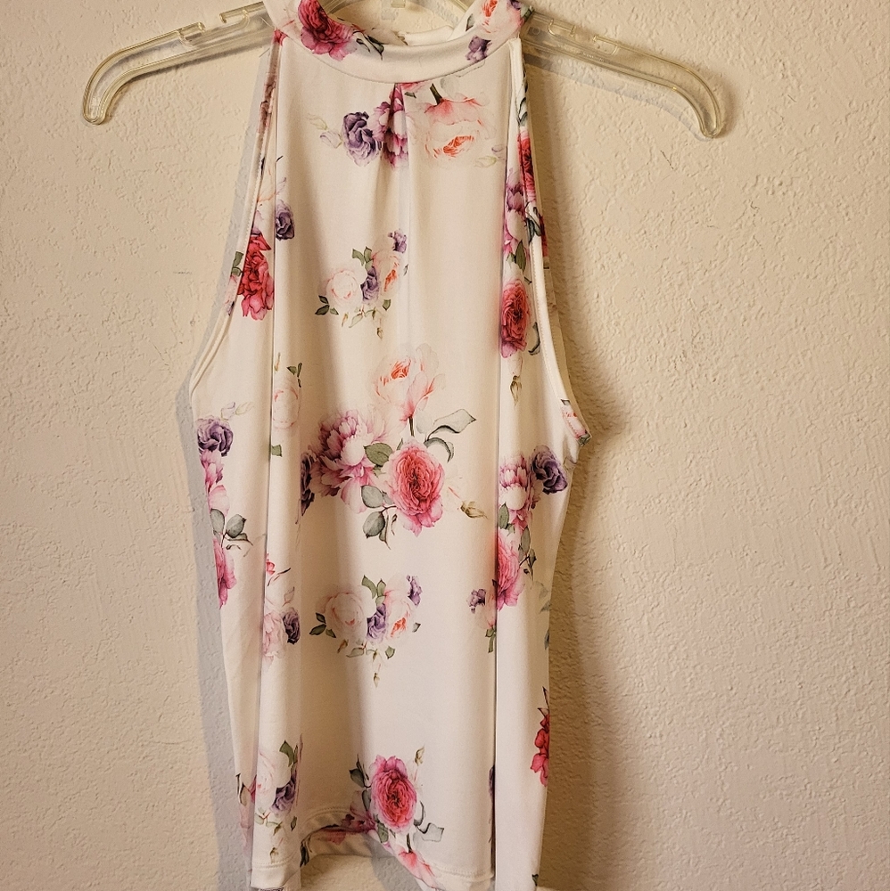 Milan Kiss top. Size S. Multi-colored floral pattern.